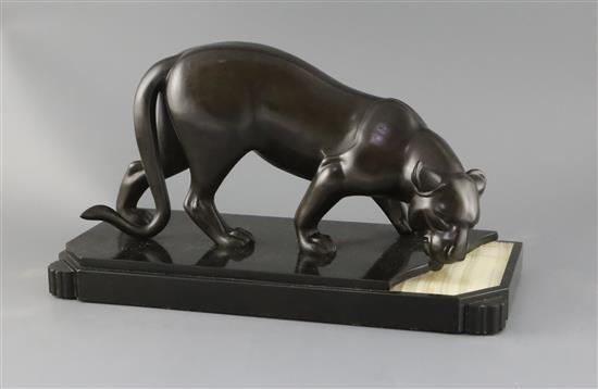 Attributed to Irene Rochard. A French Art Deco PATINATED SPELTER model of a panther drinking from a stream, width 16in. depth 7.25in. h